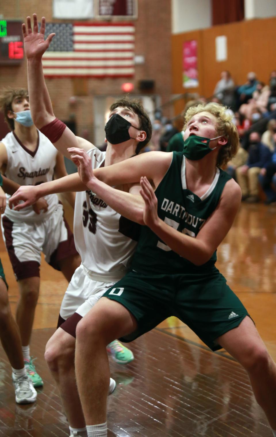 Dartmouth's Hunter Matteson and Bishop Stang's Michael Golden battle for a rebound Friday in Bishop Stang's 63-49 win over Dartmouth at the John C. O'Brien Gymnasium.