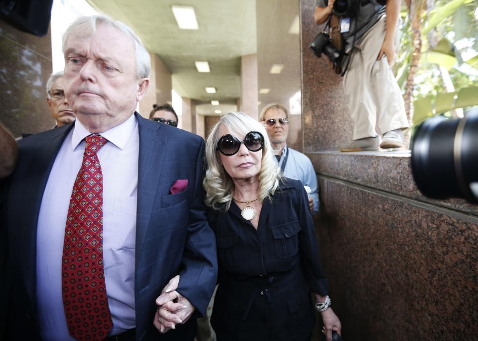 Shelly Sterling (R), 79, arrives at court with her lawyer Pierce O'Donnell in Los Angeles, California July 8, 2014. The $2 billion sale of the NBA's Los Angeles Clippers faces a key legal hurdle on Tuesday as the estranged husband and wife who own the franchise battle in court over control of the team. Shelly Sterling, 79, has asked a Los Angeles judge to confirm her as having sole authority to sell the pro basketball franchise to former Microsoft Corp chief executive Steve Ballmer at an NBA-record price after husband Donald Sterling vowed to block the deal. REUTERS/Lucy Nicholson (UNITED STATES - Tags: CRIME LAW SPORT BASKETBALL BUSINESS)