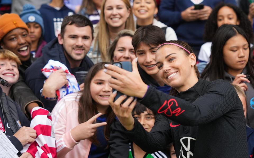 Strong local support: Alex Morgan with fans - Brad Smith/USSF/Getty Images