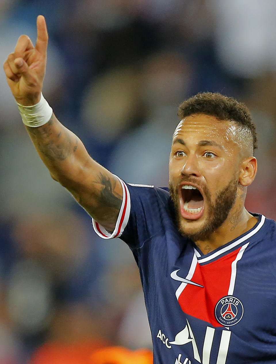 PSG's Neymar reacts during the French League One soccer match between Paris Saint-Germain and Marseille at the Parc des Princes in Paris, France, Sunday, Sept.13, 2020. (AP Photo/Michel Euler)