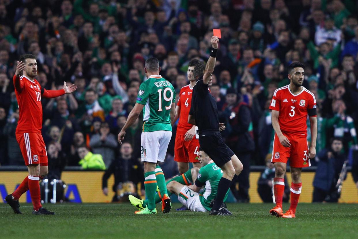 Neil Taylor is sent off for his horror challenge on Coleman: Getty Images