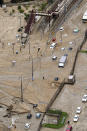 <p>Train tracks and vehicles are buried in mud caused by a heavy rain in Sakacho, Hiroshima prefecture, western Japan Saturday, July 7, 2018. (Photo: Kyodo News via AP) </p>