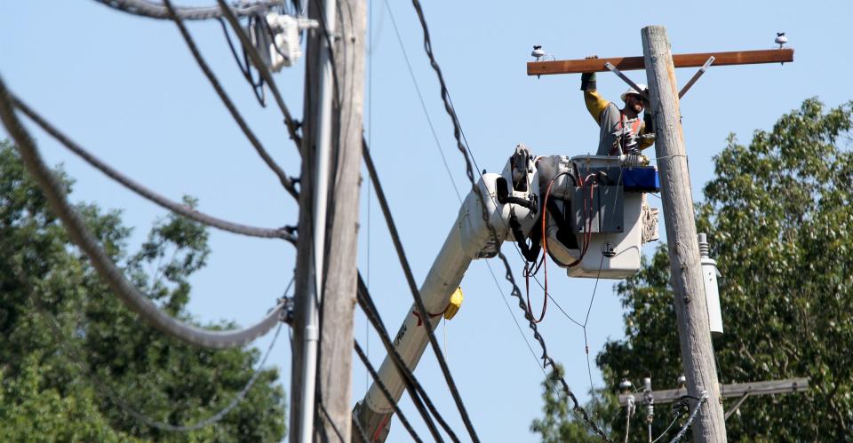 A JCP&L lineman works to restore power along Burke Road in Jackson Township Wednesday morning, August 5, 2020.