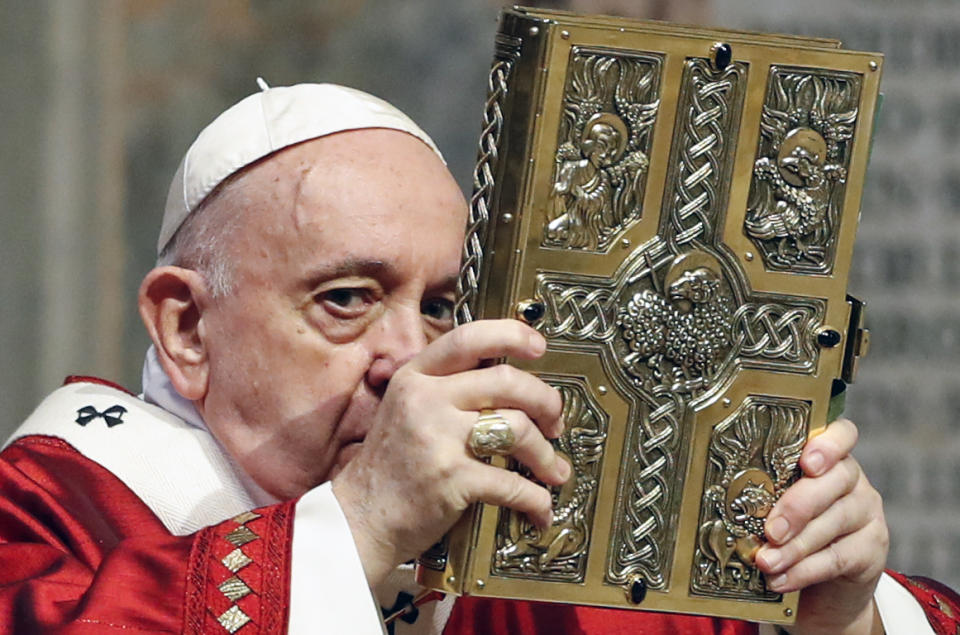 Pope Francis celebrates Mass in St. Peter's Basilica at the Vatican, Sunday, May 31, 2020. Francis celebrates a Pentecost Mass in St. Peter's Basilica on Sunday, albeit without members of the public in attendance. He will then go to his studio window to recite his blessing at noon to the crowds below. The Vatican says police will ensure the faithful gathered in the piazza keep an appropriate distance apart. (Remo Casilli/Pool Photo via AP)