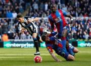 Britain Football Soccer - Newcastle United v Crystal Palace - Barclays Premier League - St James' Park - 30/4/16 Crystal Palace's Damien Delaney and Yannick Bolasie in action with Newcastle's Ayoze Perez Reuters / Andrew Yates Livepic