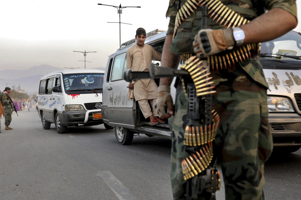 In this Tuesday, Sept. 24, 2019 photo, Afghan National Army soldiers stand guard at a checkpoint ahead of presidential elections scheduled for Sept. 28, in Kabul, Afghanistan. Afghans facing down Taliban threats are torn between fear, frustration and sense of duty as they decide whether to go to the polls Saturday to choose a new president. But the security preparations have been elaborate. (AP Photo/Ebrahim Noroozi)