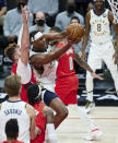 Indiana Pacers center Myles Turner, right, shoots in front of Portland Trail Blazers center Jusuf Nurkic during the first half of an NBA basketball game in Portland, Ore., Thursday, Jan. 14, 2021. (AP Photo/Craig Mitchelldyer)