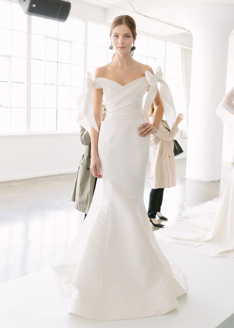 Off-the shoulder white gown with bow shoulder details from the Marchesa Spring 2018 bridal collection