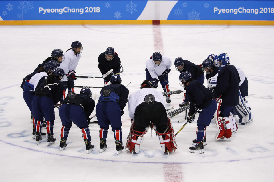 The joint Korean women’s ice hockey players gather on the ice during a training session prior to the 2018 Winter Olympics. (AP Photo/Jae C. Hong)