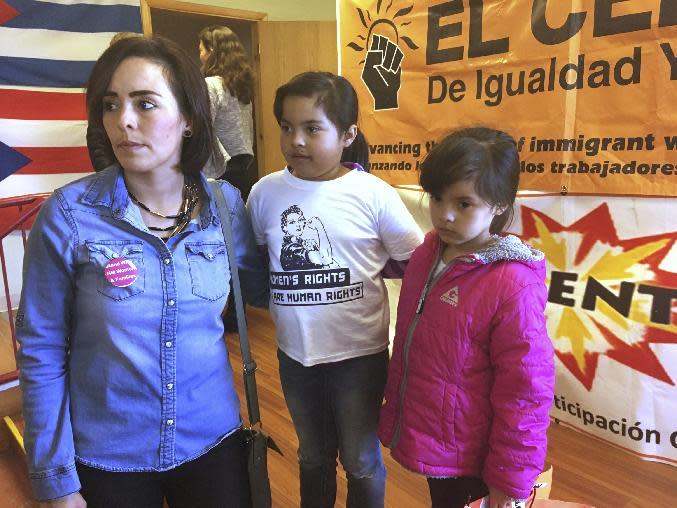 Jessica Rodriguez, left, with her daughters, Jennifer, 8, center and Jocelynn, 6, attend a news conference in Albuquerque, N.M., Wednesday, Jan. 25, 2017, where activists denounced President Donald Trump's executive actions on immigration. Many U.S. Muslim and Latino advocates have been speaking out and preparing lawsuits against executive actions taken by President Donald Trump to build a Mexican border wall and strip funding for immigrant protecting sanctuary cities, as well as anticipated orders to restrict refugees. (AP Photo/Russell Contreras)