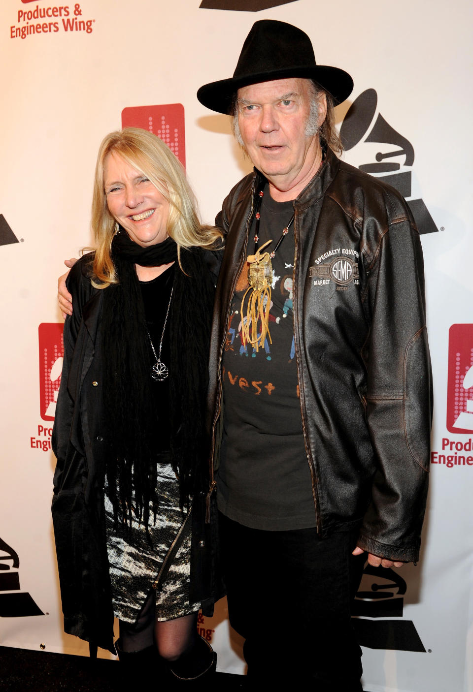 Honoree Neil Young, right, and Pegi Young arrive at the Producers and Engineers of The Academy's 7th Annual Grammy Week Event, at The Village Recording Studios, on Tuesday, Jan. 21, 2014, in Los Angeles. (Photo by Frank Micelotta//AP Images)