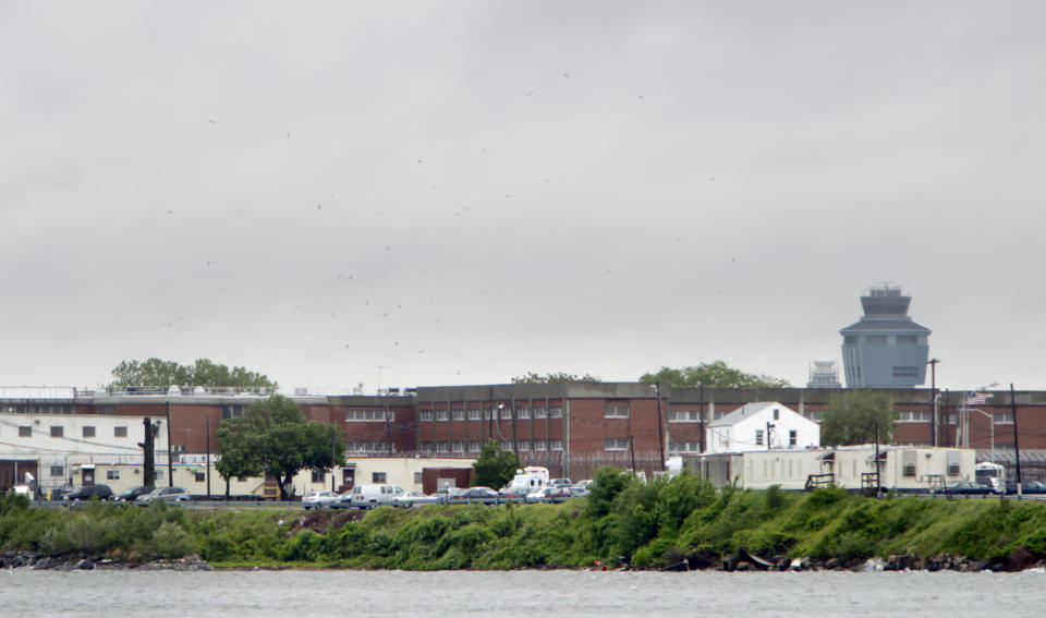 FILE - In this May 17, 2011 file photo, a section of the Rikers Island prison is seen in New York. Jerome Murdough, a mentally ill, homeless former Marine arrested for sleeping in the roof landing of a New York City public housing project during one of the coldest recorded winters in city history, died last month in a Rikers Island jail cell that multiple city officials say was at least 100 degrees when his body was discovered. Murdough, 56, was found dead in his cell in a mental observation unit in the early hours of Feb. 15, after excessive heat, believed to be caused by an equipment malfunction, redirected it’s flow to his upper-level cell, the officials said. (AP Photo/Seth Wenig, File)