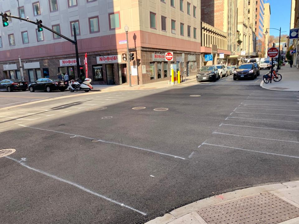 The intersection of Dorrance and Westminster streets in Providence. Recent utility work forced the city to dig up the cobblestone medallion at the center of the intersection. Because of damage to the cobblestones, they were not replaced.