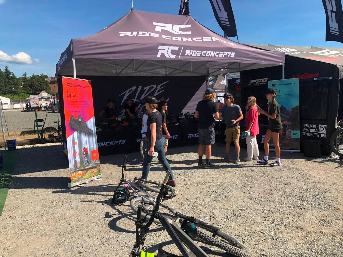 Festival attendees visit the Ride Concepts booth Sunday, July 10, near Waypoint Park on the waterfront in Bellingham during the Northwest Tune-Up festival.