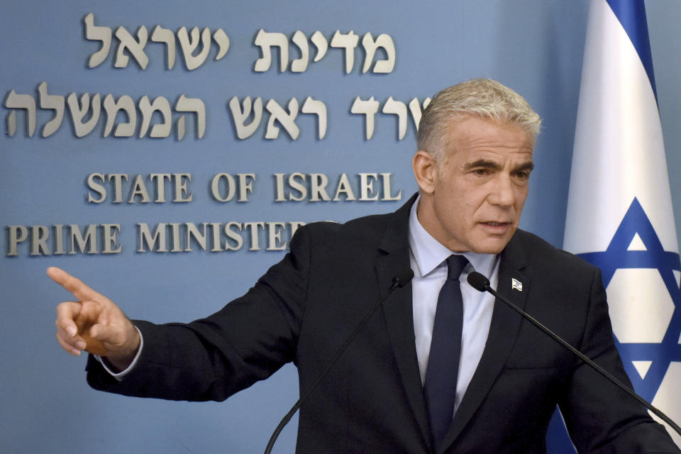 Israeli Prime Minister Yair Lapid speaks about Iran at a security briefing for the foreign press at the Prime Minister's office in Jerusalem, Wednesday, Aug. 24, 2022. Lapid called on U.S. President Joe Biden and Western powers to call off an emerging nuclear deal with Iran, saying an agreement would fail to prevent Iran from developing a nuclear bomb and reward it with billions of dollars to fund Israel's enemies. Israel's caretaker prime minister used stark language on Wednesday in his criticism of the expected agreement. (Debbie Hill/Pool via AP)