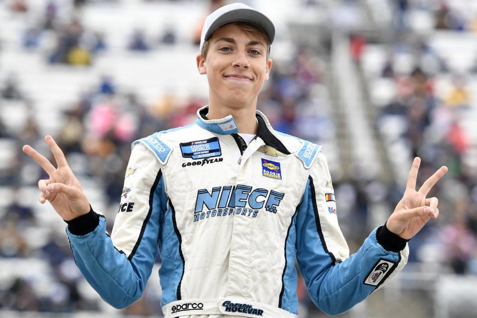 MARTINSVILLE, VIRGINIA - OCTOBER 30: Carson Hocevar, driver of the #42 Good Sam Chevrolet, walks on stage during pre-race ceremonies prior to the NASCAR Camping World Truck Series United Rentals 200 at Martinsville Speedway on October 30, 2021 in Martinsville, Virginia. (Photo by Logan Riely/Getty Images) | Getty Images