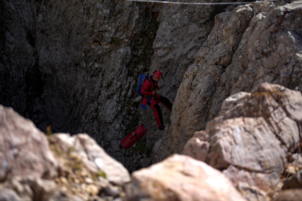 A European Cave Rescue Association (ECRA) member goes down into the Morca cave (AP)