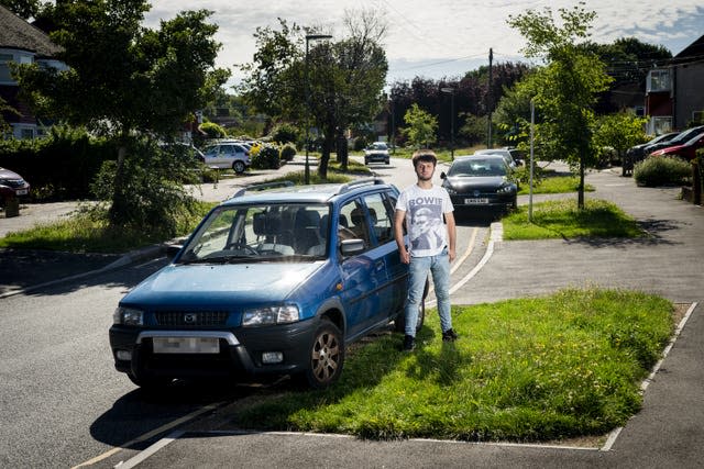 Nicholas Stone with his car