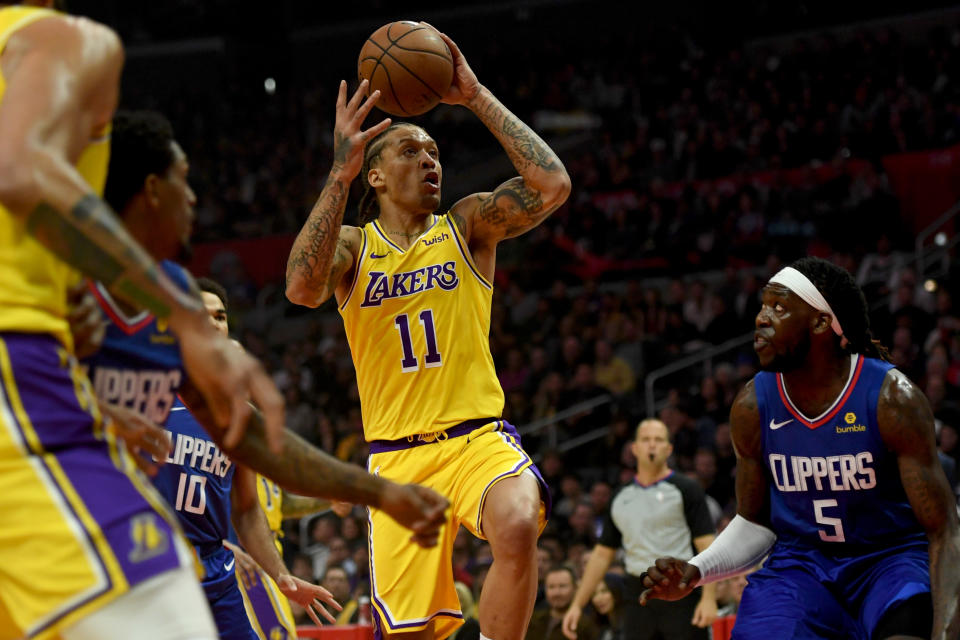 LOS ANGELES, CA - JANUARY 31: The Lakers' Michael Beasley #11 shoots as the Clippers' Montrezl Harrell #5 defends during their game at the Staples Center in Los Angeles, Thursday, Jan 31, 2019.  (Photo by Hans Gutknecht/MediaNews Group/Los Angeles Daily News via Getty Images)