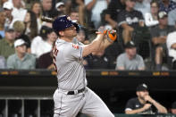 Houston Astros' Trey Mancini watches his sacrifice fly off Chicago White Sox starting pitcher Michael Kopech, scoring Yordan Alvarez, during the fourth inning of a baseball game Wednesday, Aug. 17, 2022, in Chicago. (AP Photo/Charles Rex Arbogast)