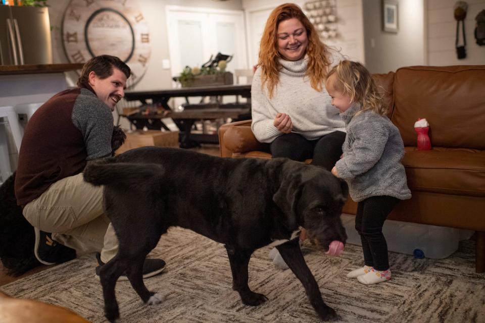 Tucker passes through the living room as his family, Cody, Natalie and Peyton, 2, go through bedtime rituals at their Evansville home Wednesday night, Nov. 10, 2021. 