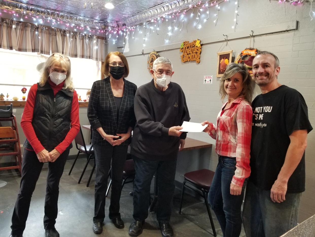 Representatives from the Bethesda Foundation present a $1,000 check to Lori and Ian Cramp, owner of Billy Schu’s Food Grill in Hornell. The donation will help the restaurant provide nearly 400 free turkey dinners to those in need this Thanksgiving. From left: Lynn Blades, Janice Spence and Stephan Greenberg of the Bethesda Foundation; Lori and Ian Cramp, restaurant owners.