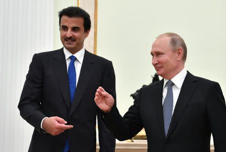 Russian President Vladimir Putin and Qatar Emir Sheikh Tamim bin Hamad al-Thani attend a meeting at the Kremlin in Moscow, Russia July 15, 2018. Yuri Kadobnov/Pool via REUTERS