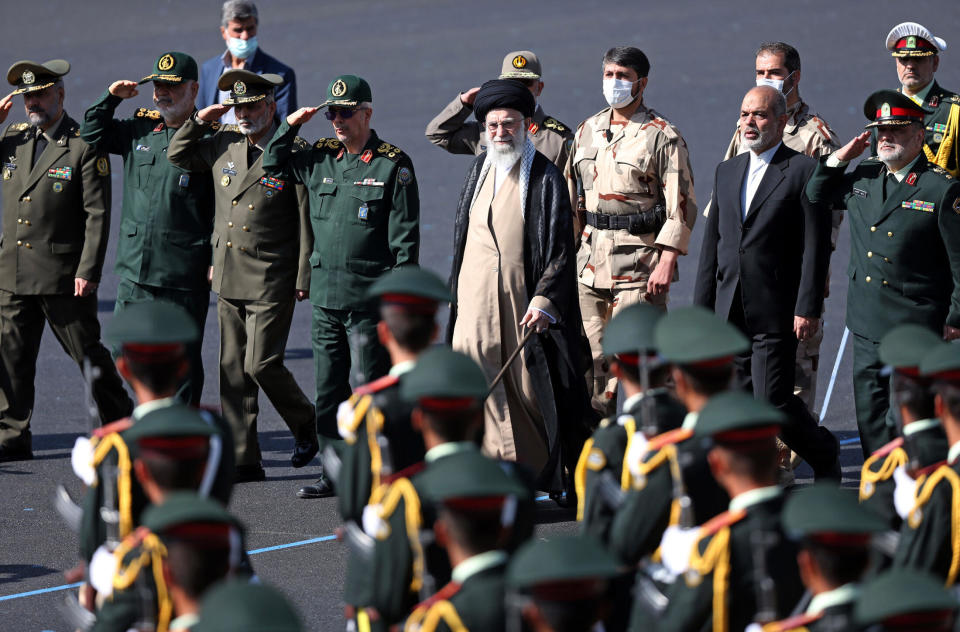 A photo released by the office of Iran's Supreme Leader Ayatollah Ali Khamenei, the supreme leader, center, reviews a group of armed forces cadets during their graduation ceremony at the police academy in Tehran, Iran, October 3, 2022. / Credit: Handout/Office of the Iranian Supreme Leader/AP