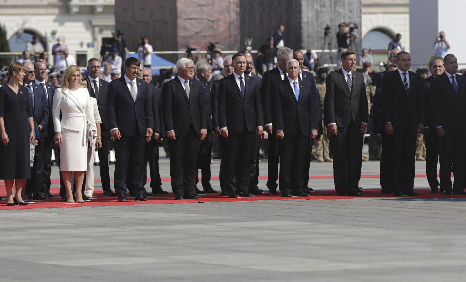 Officials and leaders, among them U.S. Vice President Mike Pence, Polish President Andrzej Duda, and German President Frank-Walter Steinmeier stand during a memorial ceremony marking the 80th anniversary of the start of World War II in Warsaw, Poland, Sunday, Sept. 1, 2019. (AP Photo/Petr David Josek)