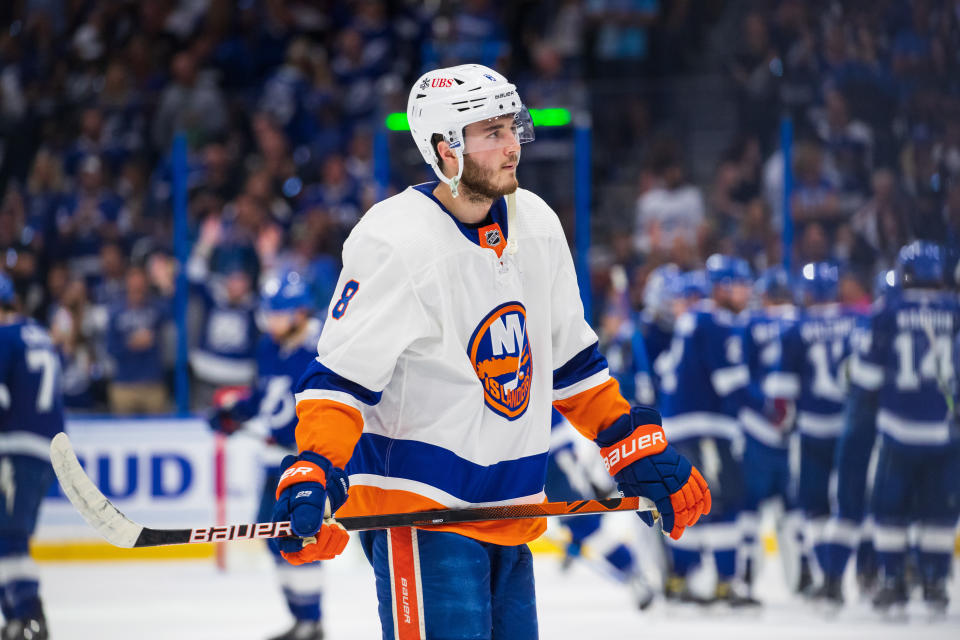 The Tampa Bay Lightning celebrate the win against Noah Dobson (8) and the New York Islanders in Game 5. (Photo by Scott Audette/NHLI via Getty Images)