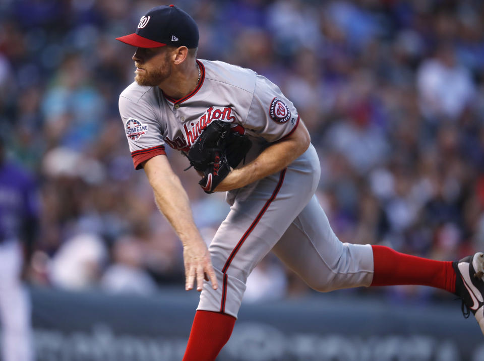 Washington Nationals starting pitcher Stephen Strasburg works against the Colorado Rockies in the first inning of a baseball game Saturday, Sept. 29, 2018, in Denver. (AP Photo/David Zalubowski)