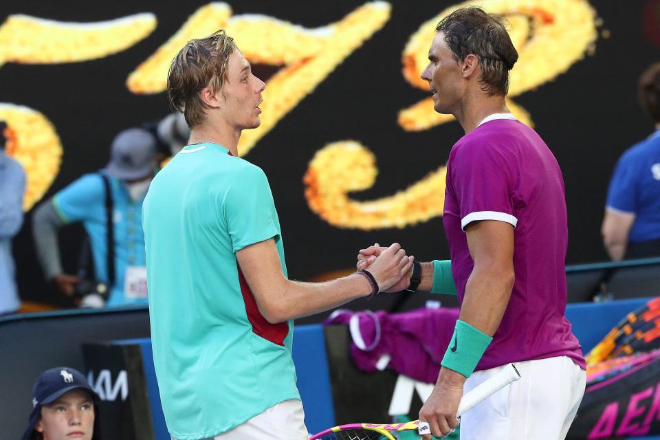 Spain's Rafael Nadal (R) embraces Canada's Denis Shapovalov after their men's singles quarter-final match on day nine of the Australian Open tennis tournament in Melbourne on January 25, 2022. - -- IMAGE RESTRICTED TO EDITORIAL USE - STRICTLY NO COMMERCIAL USE -- (Photo by Aaron FRANCIS / AFP) / -- IMAGE RESTRICTED TO EDITORIAL USE - STRICTLY NO COMMERCIAL USE -- (Photo by AARON FRANCIS/AFP via Getty Images)