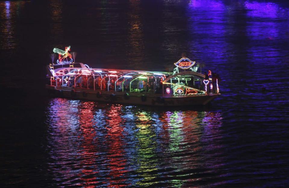 Egyptians dance on a pleasure boat travelling on the River Nile during New Year's Eve celebrations near Tahrir Square in Cairo, Egypt December 31, 2012.