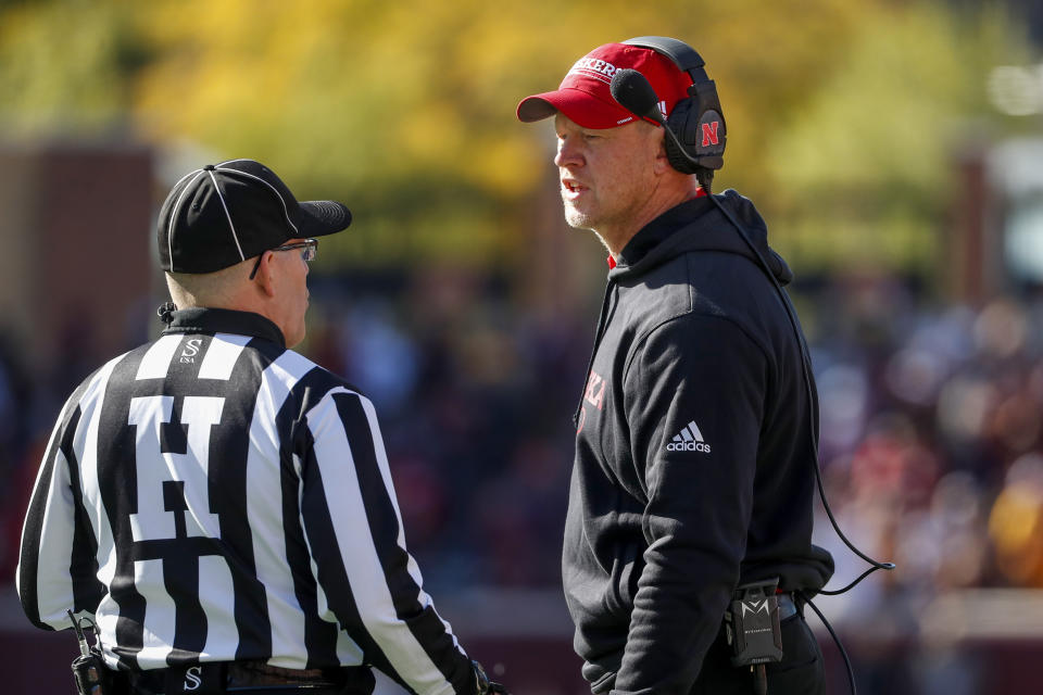 Nebraska head coach Scott Frost speaks with an official during the an NCAA college football game against Minnesota, Saturday, Oct. 16, 2021, in Minneapolis. Minnesota won 30-23. (AP Photo/Bruce Kluckhohn)