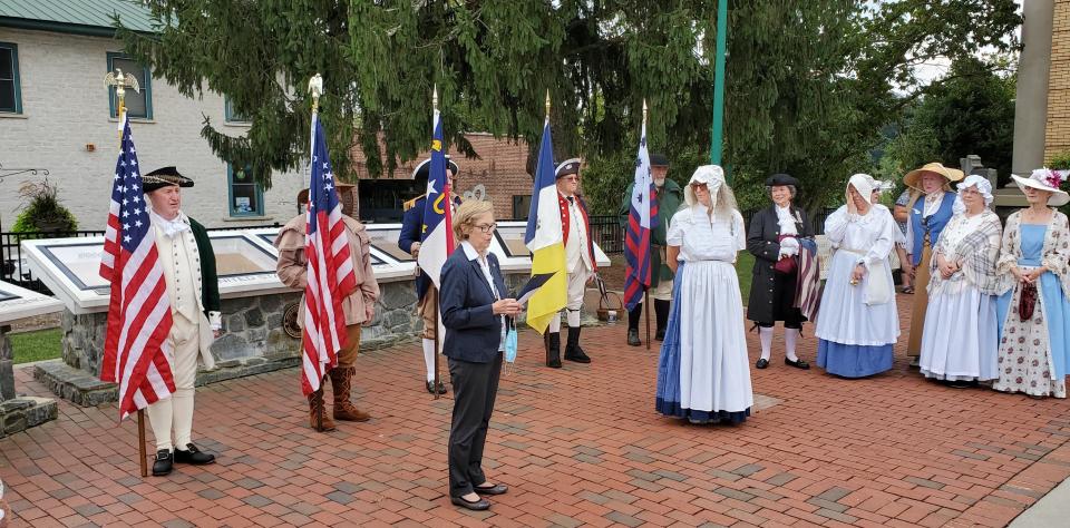 The 2021 ceremony for Bells Across America featured Mayor Barbara Volk, center, issuing a proclamation.