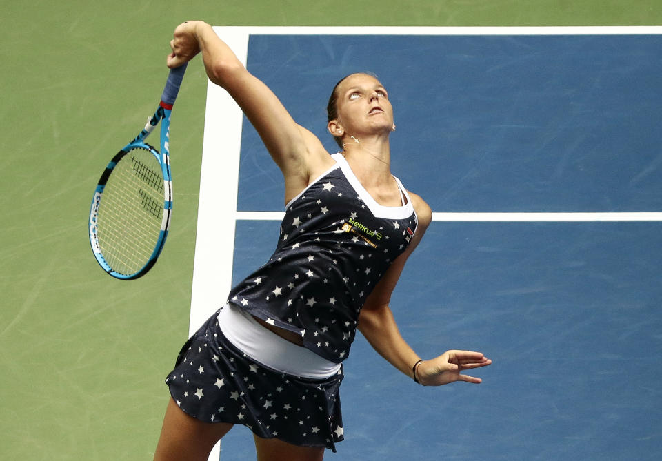 Karolina Pliskova, of the Czech Republic, serves to Ashleigh Barty, of Australia, during the fourth round of the U.S. Open tennis tournament, Sunday, Sept. 2, 2018, in New York. (AP Photo/Andres Kudacki)