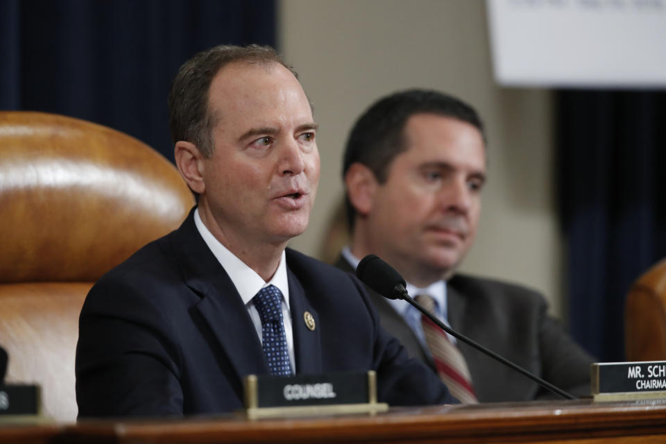 House Intelligence Committee Chairman Adam Schiff, D-Calif., question Jennifer Williams, an aide to Vice President Mike Pence, and National Security Council aide Lt. Col. Alexander Vindman, as they testify before the House Intelligence Committee on Capitol Hill in Washington, Tuesday, Nov. 19, 2019, during a public impeachment hearing of President Donald Trump's efforts to tie U.S. aid for Ukraine to investigations of his political opponents. Ranking member Rep. Devin Nunes, R-Calif., right. (AP Photo/Alex Brandon)