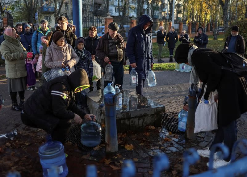 Local residents queue for water after a Russian missile attack in Kyiv