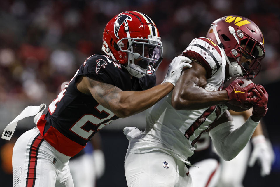 Washington Commanders wide receiver Terry McLaurin (17) makes the catch against Atlanta Falcons cornerback A.J. Terrell (24) during the first half of an NFL football game, Sunday, Oct. 15, 2023, in Atlanta. (AP Photo/Butch Dill)