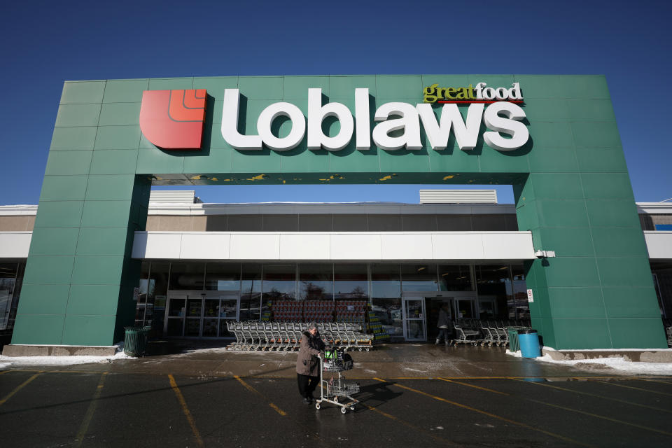 A shopper leaves a Loblaw grocery store in Ottawa, Ontario, Canada, February 14, 2019. REUTERS/Chris Wattie