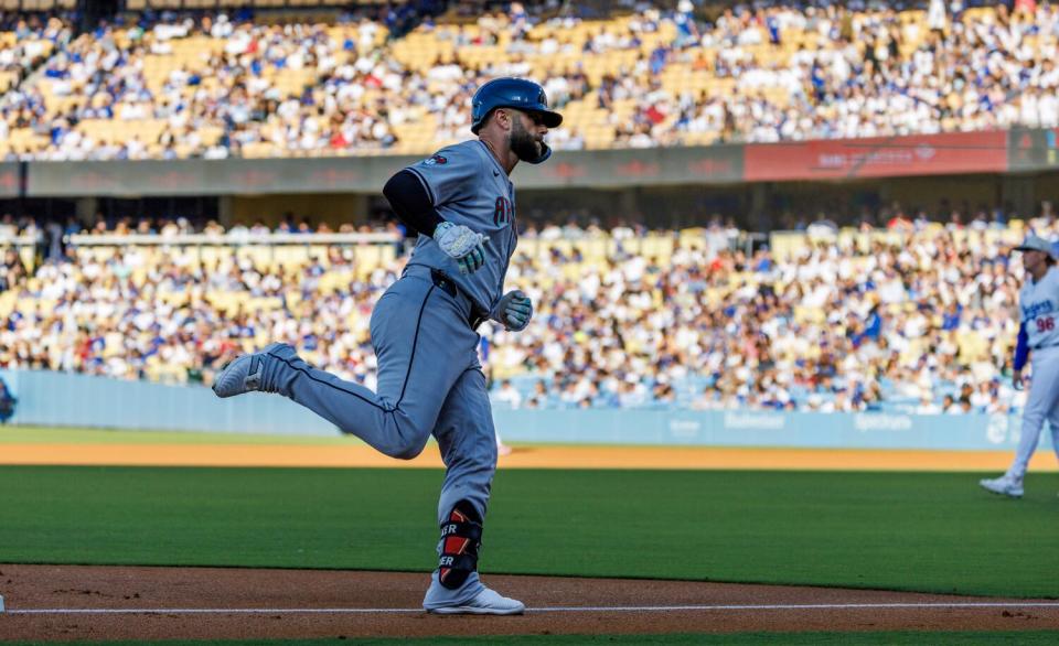 Arizona's Christian Walker rounds third base after hitting a home run in the first inning against the Dodgers on Thursday.