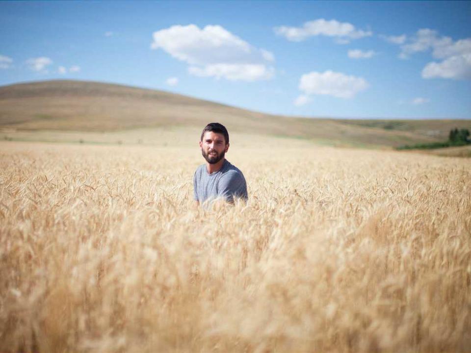 Man Sitting in Field