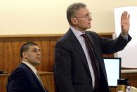 Former NFL player Aaron Hernandez (L) listens during questioning by attorney Charles Rankin during his murder trial in Fall River Massachusetts, March 30, 2015. Hernandez is accused of the June 2013 killing of semi-professional football player Odin Lloyd. REUTERS/Ted Fitzgerald/Pool