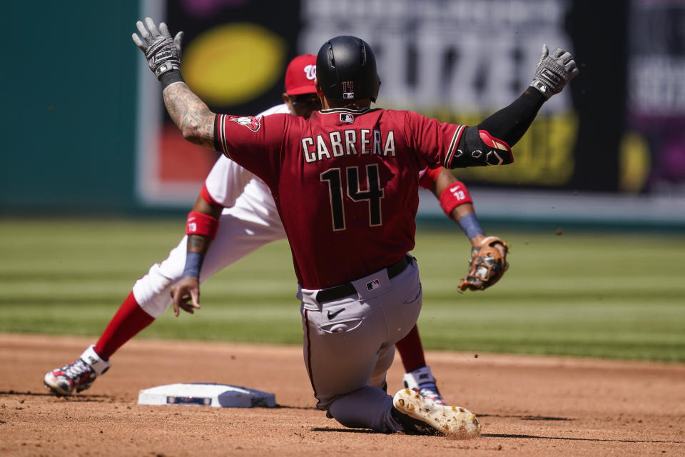 Arizona Diamondbacks' Asdrúbal Cabrera is out on the tag by Washington Nationals second baseman Starlin Castro trying to reach second on a single, during the third inning of a baseball game at Nationals Park, Sunday, April 18, 2021, in Washington. (AP Photo/Alex Brandon)