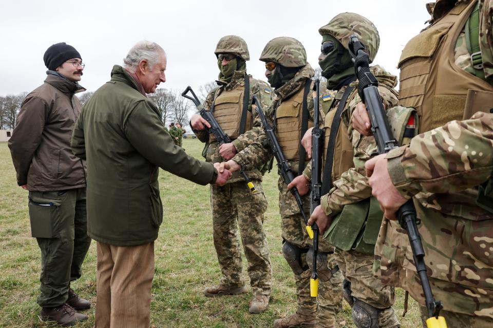 King Charles III meets with Ukrainian recruits being trained by British and international partner forces on February 20, 2023 in Wiltshire, England.