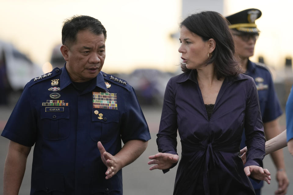 German Foreign Minister Annalena Baerbock, right, talks with Philippine Coast Guard Commandant Admiral Ronnie Gil Gavan during her visit to Philippine coast guard headquarters in Manila, Philippines on Thursday, Jan. 11, 2024. (AP Photo/Aaron Favila)