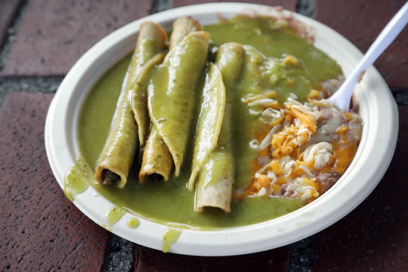LOS ANGELES, CA -- NOVEMBER 06, 2019: Cielito Lindo has been serving taquitos since 1934. These are beef taquitos in their signature avocado sauce. (Myung J. Chun / Los Angeles Times)