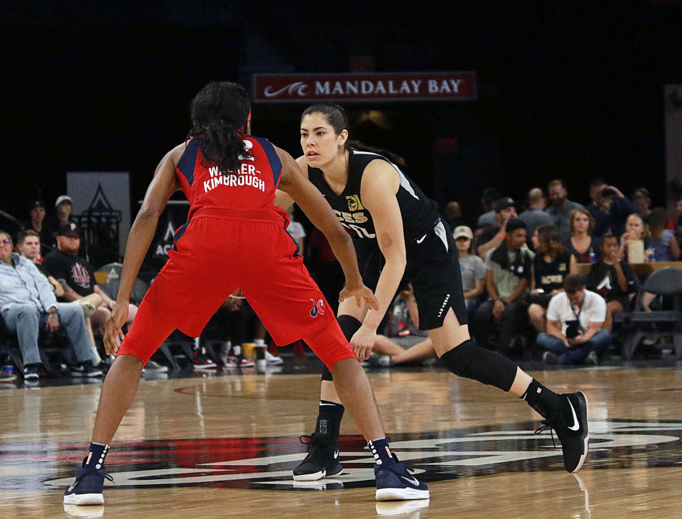 Las Vegas Aces head coach Becky Hammon tackles Kelsey Plum during a heated timeout confrontation