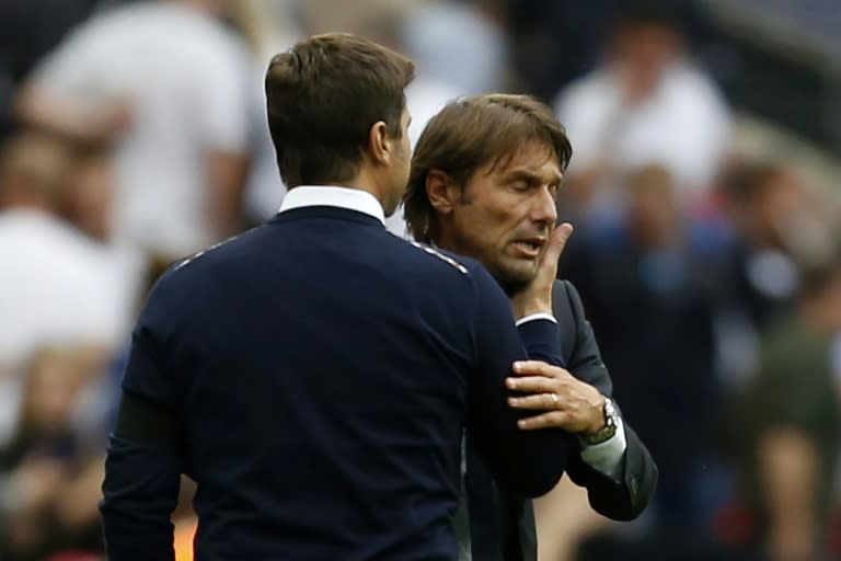 Tottenham Hotspur's head coach Mauricio Pochettino (L) and Chelsea's head coach Antonio Conte interact during an English Premier League football match in London, on August 20, 2017