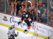 Anaheim Ducks' Mathieu Perreault, center, celebrates his goal near Dallas Stars' Vernon Fiddler during the first period in Game 1 of the first-round NHL hockey Stanley Cup playoff series on Wednesday, April 16, 2014, in Anaheim, Calif. (AP Photo/Jae C. Hong)